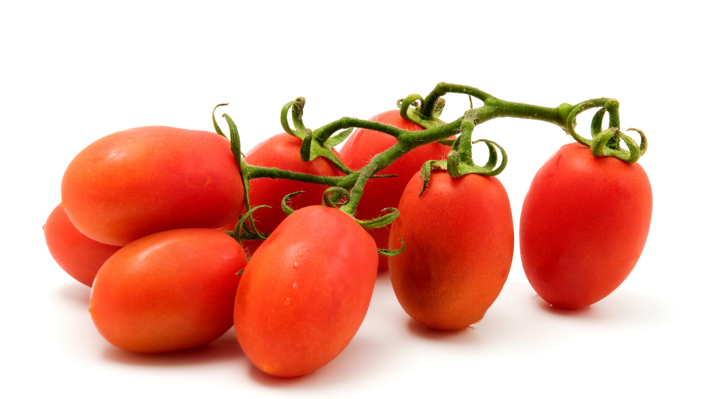 Red grape tomatoes growing in clusters, perfect for snacking and salads